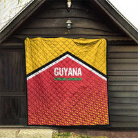 Wall-hung quilt with yellow top, red dotted center, and GUYANA Amazon Warriors lettering