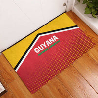 Guyana cricket rubber doormat with red center logo and yellow border on floor