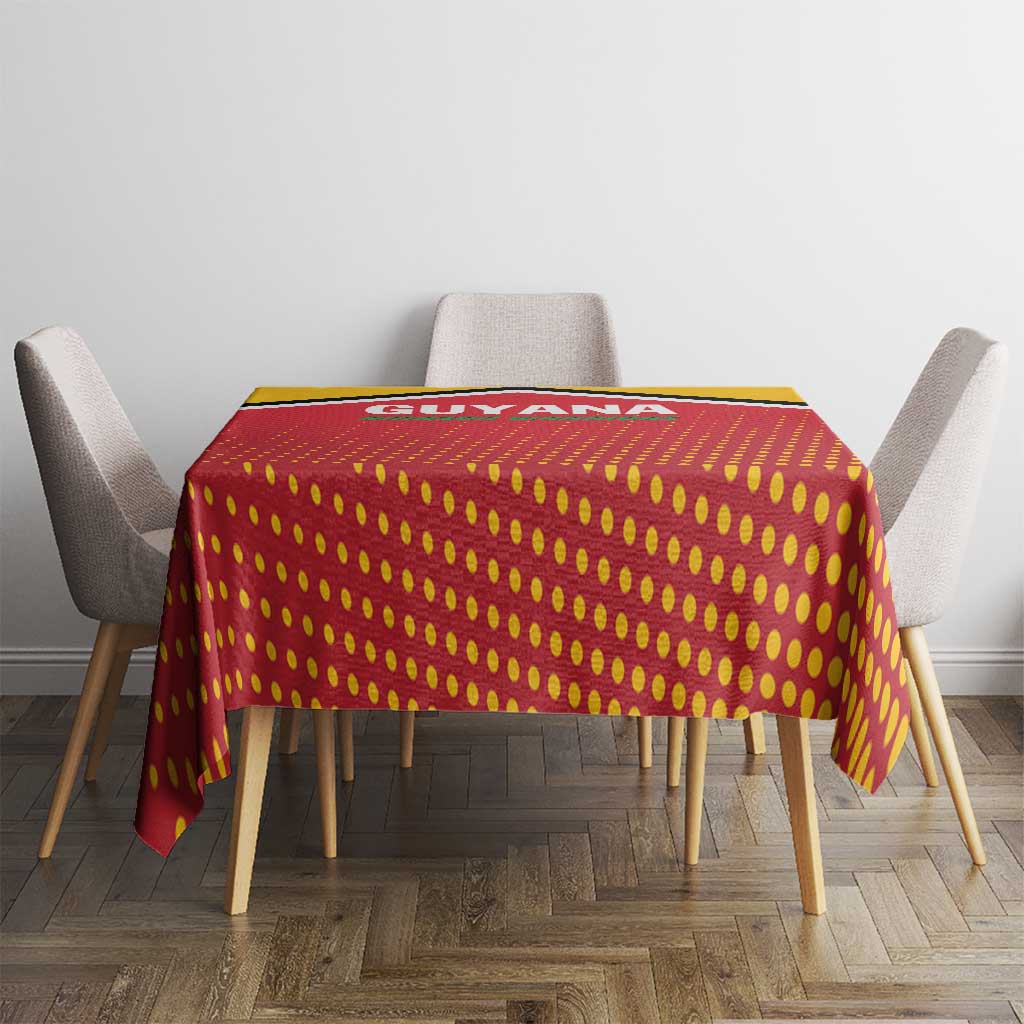 Red and yellow dotted cricket tablecloth with black trim, centered on dining table