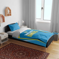 Blue cricket bedding on bed frame with Saint Lucia Kings logo panel and gold accents