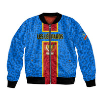 Blue unisex bomber jacket with front zipper, black ribbed cuffs, crest and sleeve patch