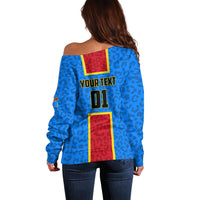 Blue off-shoulder sweater back view with YOURTEXT 01 graphic and leopard print