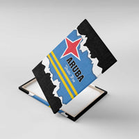 Angled black-framed canvas wall art featuring Aruba flag design and “Dushi Tera”