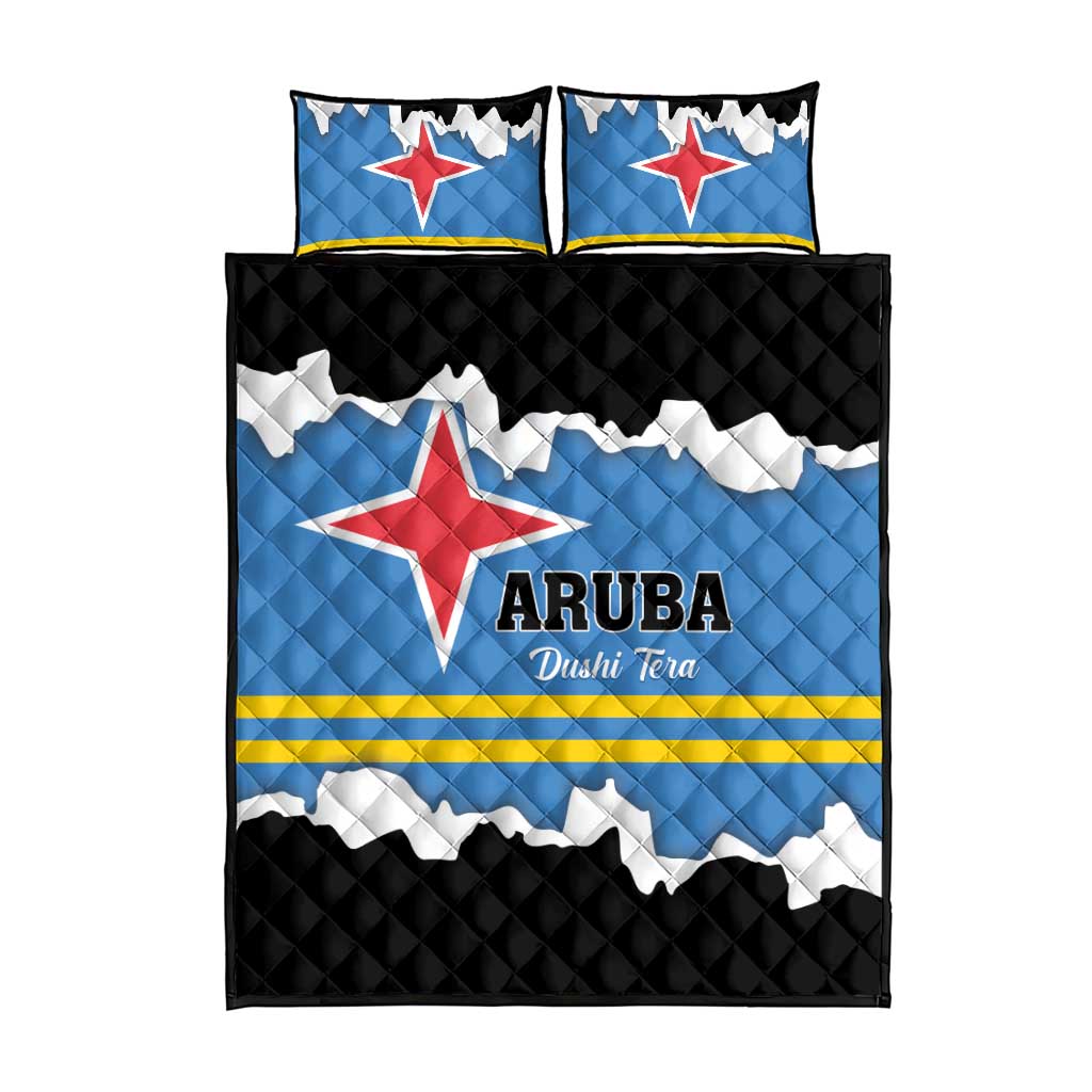 Quilt bed set with two pillowcases, blue flag graphic, ARUBA text, and black diamond backing
