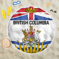 White round beach blanket with British Columbia crest and flag graphic, fringed edge