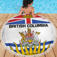 White round beach blanket with British Columbia crest and banner, fringed edge