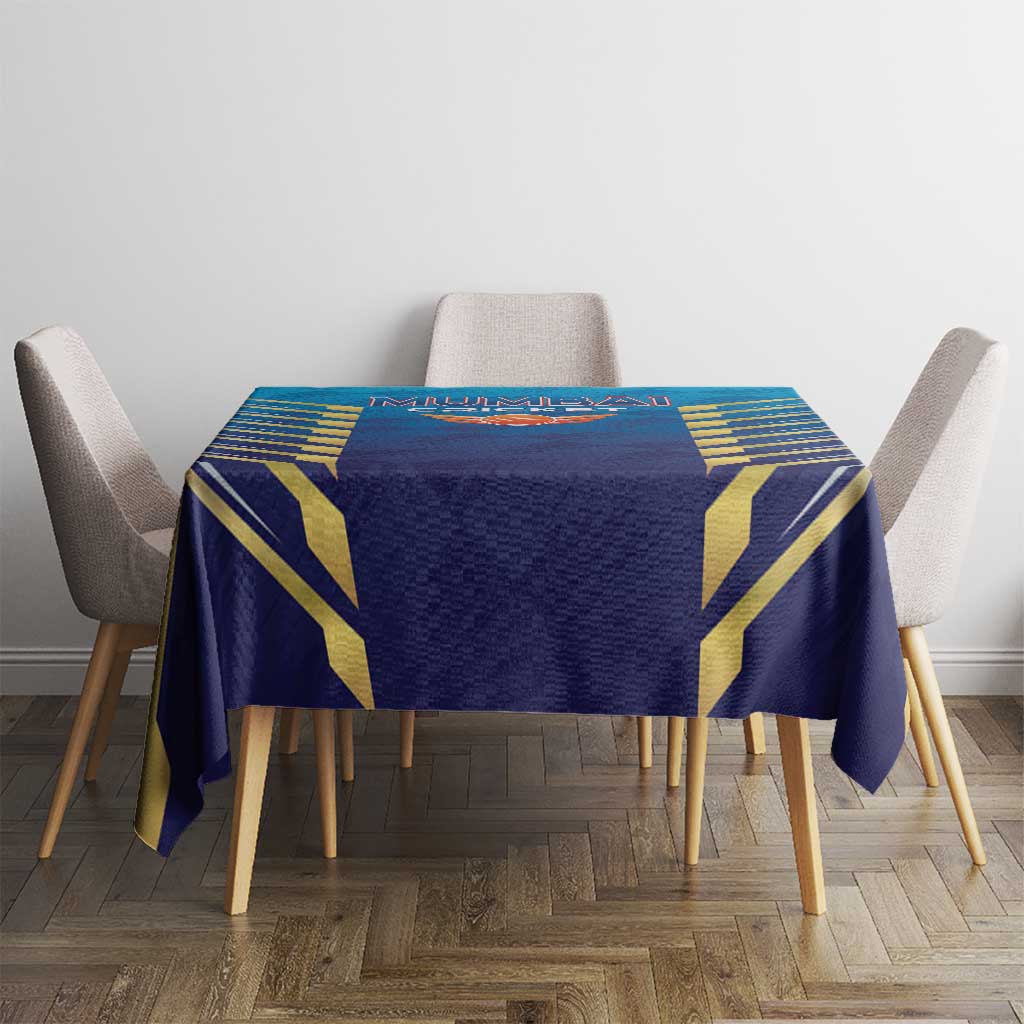 Blue dining tablecloth with gold geometric design displayed on round table