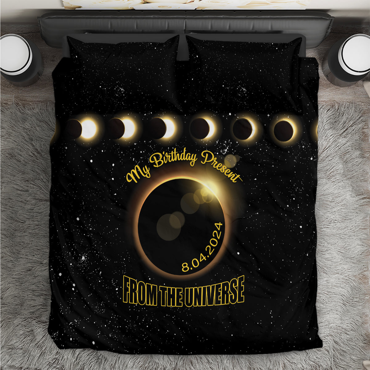 Black bedding set with starry eclipse graphic, gold text, and crescent moons on duvet