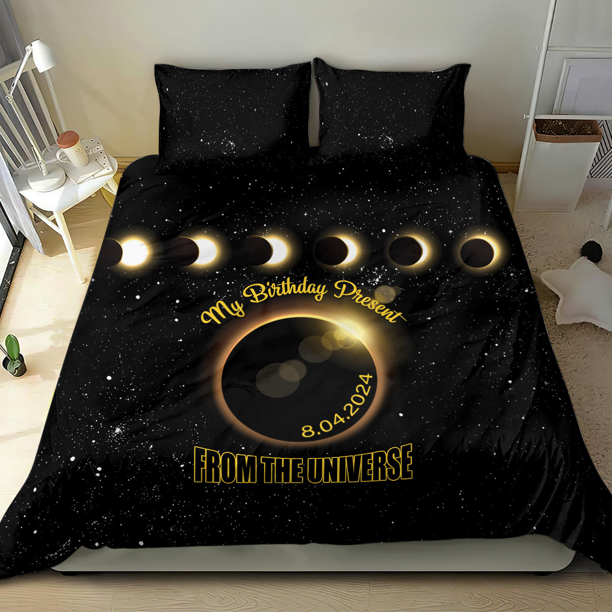 Black bedding set featuring starry eclipse graphic, gold “FROM THE UNIVERSE” text