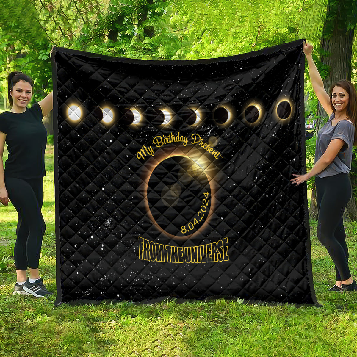 Black quilt with diamond pattern, golden planet rings, circular eclipse, 'My Birthday Present'