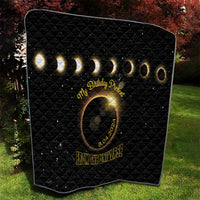Black quilt with diamond stitching, glowing rings and eclipse emblem, '8.04.2024' text