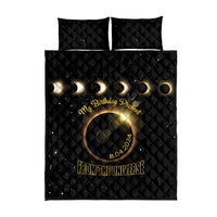 Black quilt and pillow set with circular eclipse design and gold birthday text