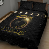 Black eclipse quilt bed set with gold ring graphic, moons, and matching pillows