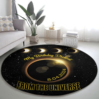 Black round eclipse birthday carpet with gold text 'From the Universe' and 8.04.2024