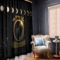 Black eclipse-themed window curtains with gold text and ringed moon design, hanging full length