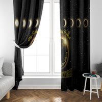 Black window curtain panels with gold crescent and eclipse circle motif, gathered at edges