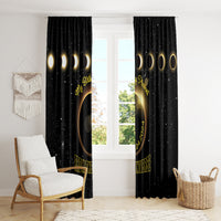 Black eclipse window curtains with gold ring graphic and star speckles, neatly draped