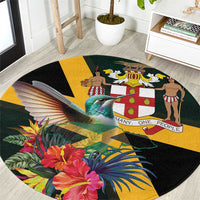 Round tropical area rug with black background, hummingbird, flowers and yellow geometric panels
