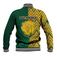 Unisex baseball jacket back, green with yellow tribal yoke, large protea graphic