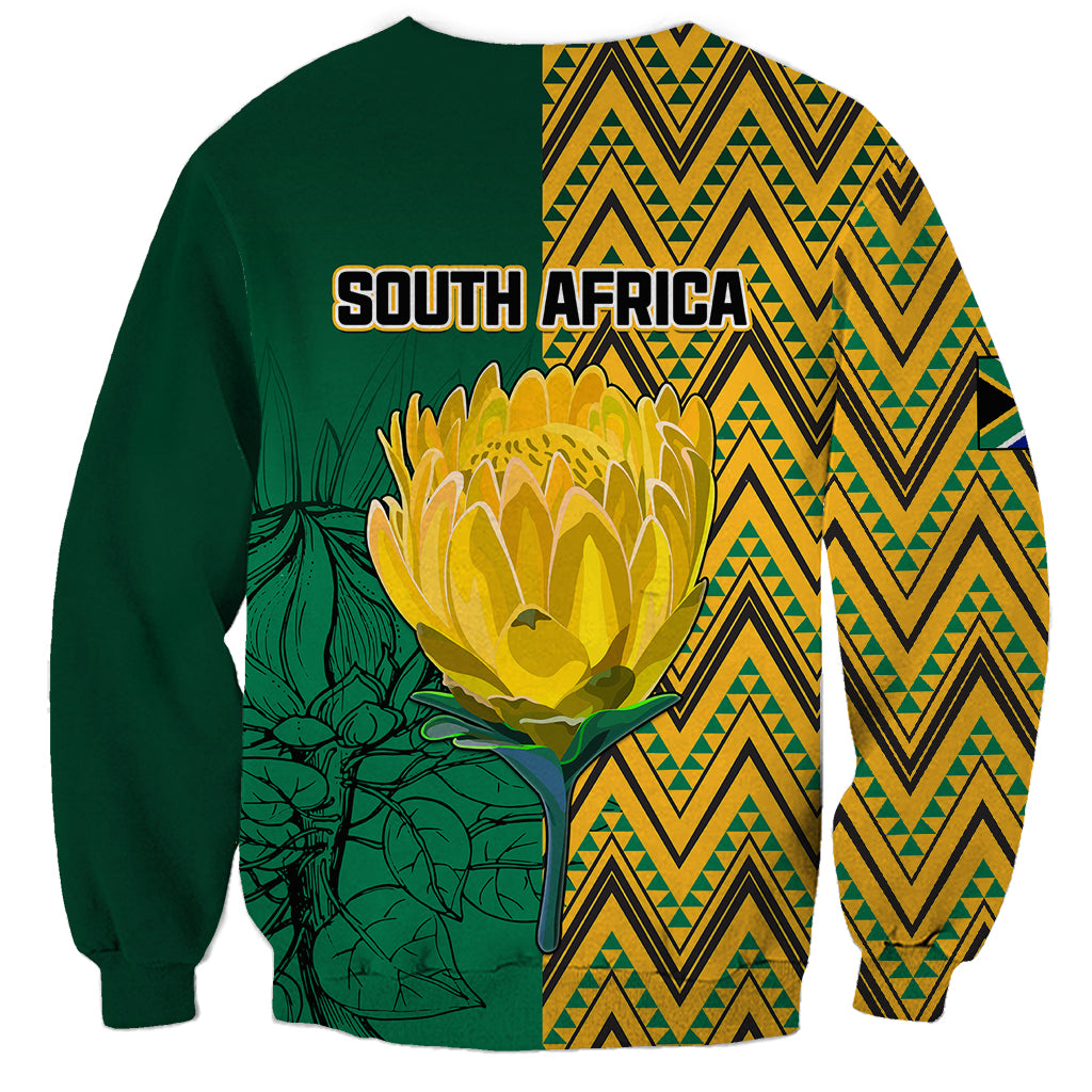 Unisex dark green sweatshirt with South Africa graphic, large protea and zigzag back
