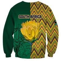 Unisex dark green sweatshirt with South Africa graphic, large protea and zigzag back