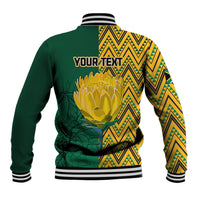 Unisex baseball jacket back, green body, yellow zigzag panels, flower crest, 'YOUR TEXT'