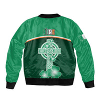 Green bomber jacket with back Celtic cross design and clover patterns, black rib hem