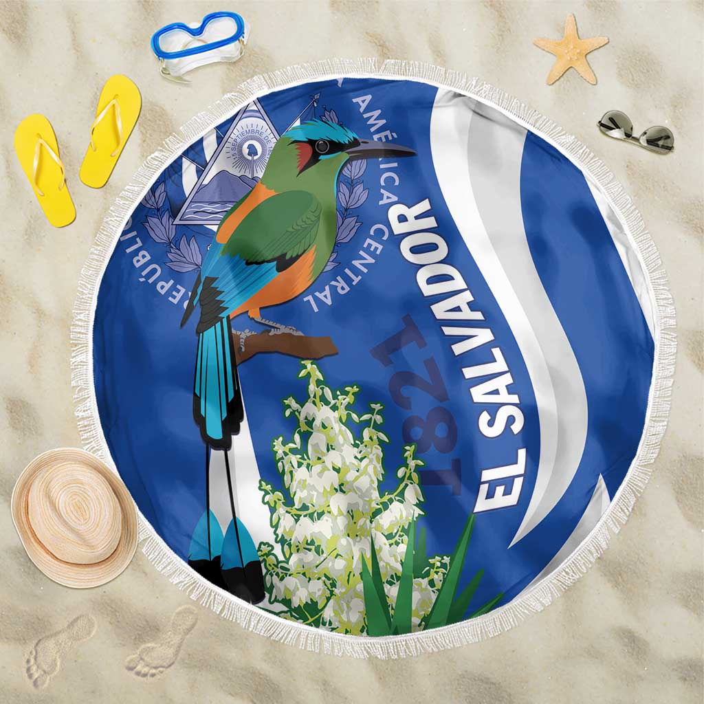 Blue round beach blanket with fringed edge and colorful bird and flowers print