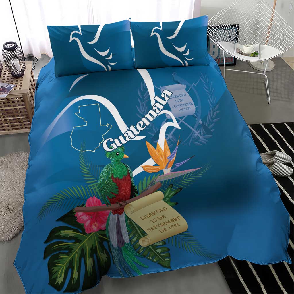Blue tropical bedding set with quetzal, flowers, and Guatemala graphic on duvet and pillows
