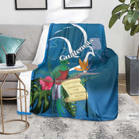 Blue tropical throw blanket with quetzal, flowers, and Guatemala banner design