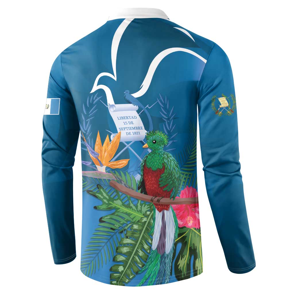 Blue henley sweatshirt back view with tropical quetzal, leaves, and white outline design