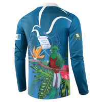Blue henley sweatshirt back view with tropical quetzal, leaves, and white outline design