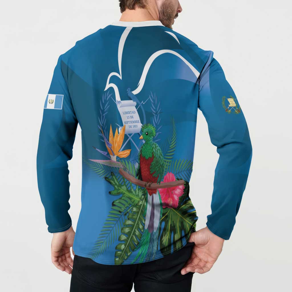 Blue henley sweatshirt worn by model, back graphic with quetzal, leaves, and white outline