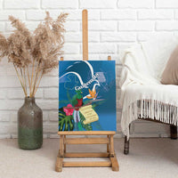 Blue canvas wall art on an easel featuring a quetzal bird, lilies, and tropical foliage