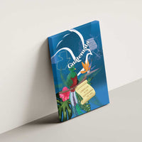 Blue canvas wall art featuring quetzal bird, tropical foliage, and Guatemala text