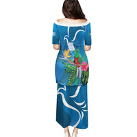 Blue long off-shoulder dress with tropical bird and plant print, back view