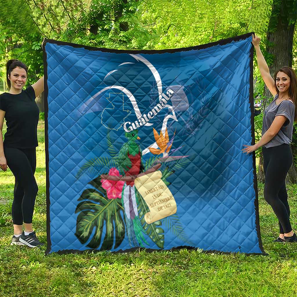 Blue rectangular quilt blanket featuring Quetzal and tropical flower artwork
