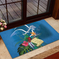 Blue rubber doormat with Guatemala crest, tropical leaves, bird, and flower bouquet