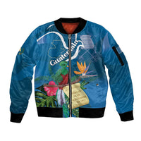 Blue unisex bomber jacket with front zip; tropical bird and flower graphic, black rib trim