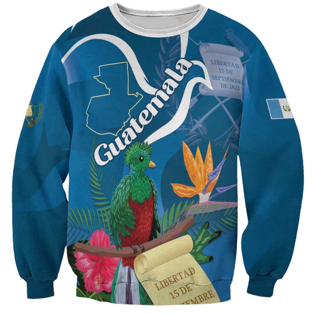 Blue unisex sweatshirt with quetzal bird, tropical flowers, and Guatemala map graphic