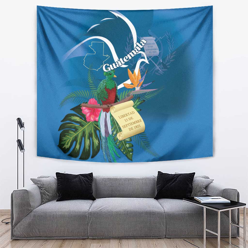 Blue wall tapestry featuring a quetzal bird with tropical leaves, pink flowers, and scroll