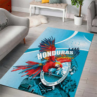 Blue area rug with scarlet macaw graphic, “HONDURAS” lettering, and crest