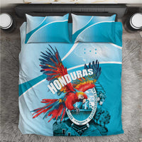 Sky blue duvet and pillowcases featuring Honduras crest with scarlet macaw artwork