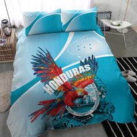 Sky blue bedding set with Honduras crest and colorful scarlet macaw on duvet and pillows