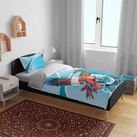 Sky blue duvet featuring Honduras crest and scarlet macaw design with matching pillowcases