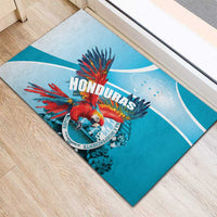 Blue rubber doormat with red macaw wing artwork and Honduras Independence text