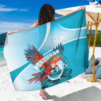 Blue sarong with large HONDURAS circular emblem, red macaw and wave pattern