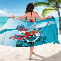 Blue sarong with wide print of HONDURAS logo, red macaw and turquoise waves