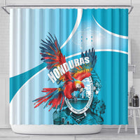 Blue shower curtain featuring macaw beside Honduras emblem and circular badge graphic