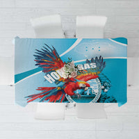 Blue printed tablecloth with colorful macaw and Honduras-style emblem in center panel
